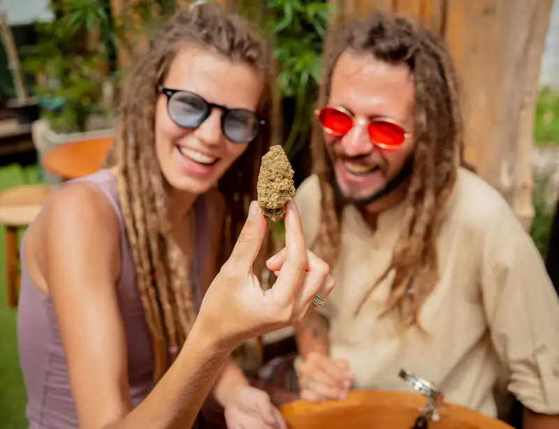 Happy couple enjoying legal cannabis outdoors in Canada